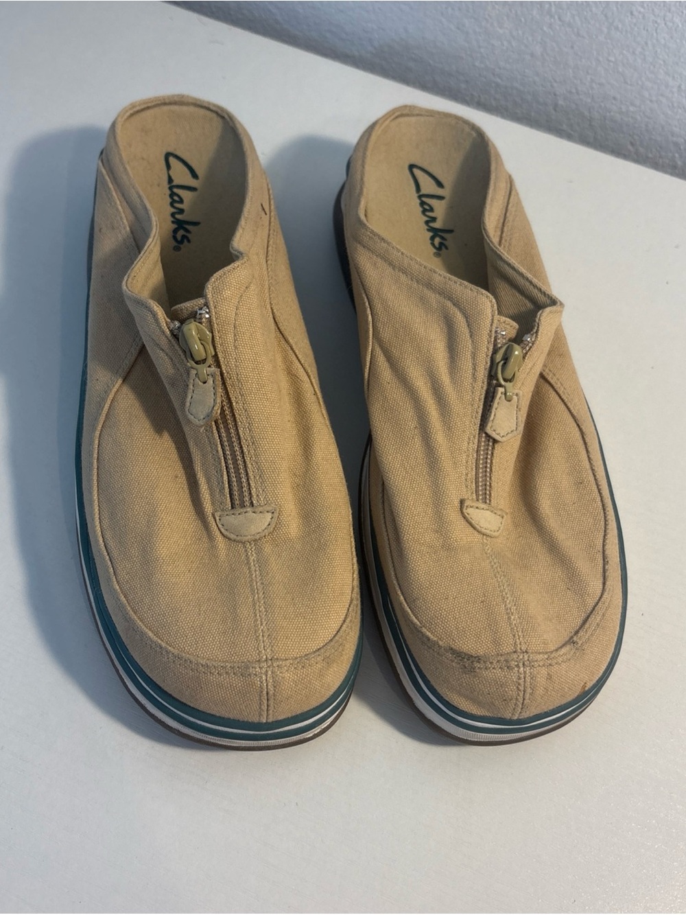 Clark’s Size 9 Khaki Slip Ons